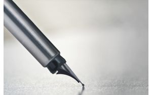 Close-up of a fountain pen nib touching paper