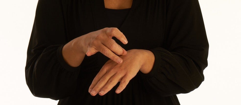 Hands communicating with British Sign language 