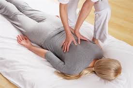 Woman receiving shiatsu treatment